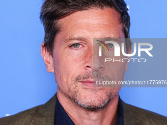 Simon Rex arrives at the Los Angeles Premiere Of A24's 'Queer' held at the Directors Guild of America Theater Complex on November 13, 2024 i...