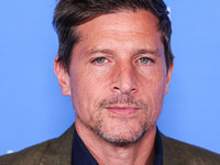 Simon Rex arrives at the Los Angeles Premiere Of A24's 'Queer' held at the Directors Guild of America Theater Complex on November 13, 2024 i...