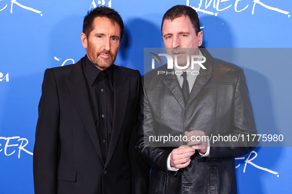 Trent Reznor and Atticus Ross arrive at the Los Angeles Premiere Of A24's 'Queer' held at the Directors Guild of America Theater Complex on...