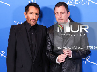 Trent Reznor and Atticus Ross arrive at the Los Angeles Premiere Of A24's 'Queer' held at the Directors Guild of America Theater Complex on...