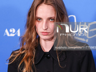 Petra Collins arrives at the Los Angeles Premiere Of A24's 'Queer' held at the Directors Guild of America Theater Complex on November 13, 20...