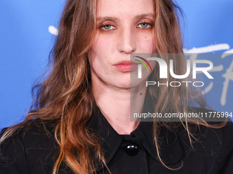 Petra Collins arrives at the Los Angeles Premiere Of A24's 'Queer' held at the Directors Guild of America Theater Complex on November 13, 20...