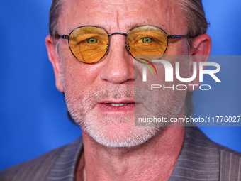 Daniel Craig arrives at the Los Angeles Premiere Of A24's 'Queer' held at the Directors Guild of America Theater Complex on November 13, 202...