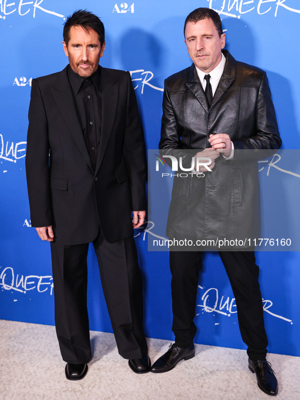 Trent Reznor and Atticus Ross arrive at the Los Angeles Premiere Of A24's 'Queer' held at the Directors Guild of America Theater Complex on...