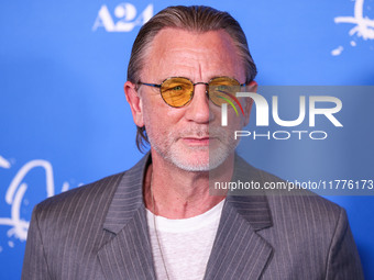 Daniel Craig arrives at the Los Angeles Premiere Of A24's 'Queer' held at the Directors Guild of America Theater Complex on November 13, 202...