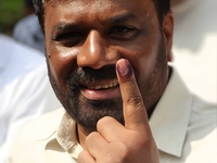 Sri Lankan President Anura Kumara Dissanayake shows his finger marked with indelible ink after casting his vote for the parliamentary electi...