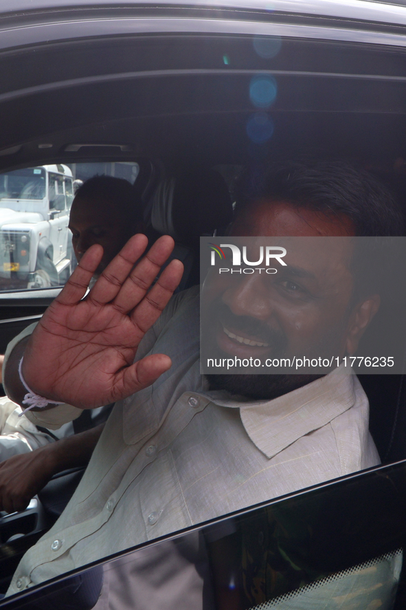 Sri Lankan president Anura Kumara Dissanayake acknowledges his supporters after casting his vote for the parliamentary election in Colombo,...