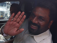 Sri Lankan president Anura Kumara Dissanayake acknowledges his supporters after casting his vote for the parliamentary election in Colombo,...