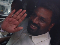 Sri Lankan president Anura Kumara Dissanayake acknowledges his supporters after casting his vote for the parliamentary election in Colombo,...