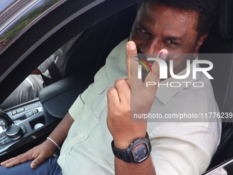 Sri Lankan president Anura Kumara Dissanayake acknowledges his supporters after casting his vote for the parliamentary election in Colombo,...