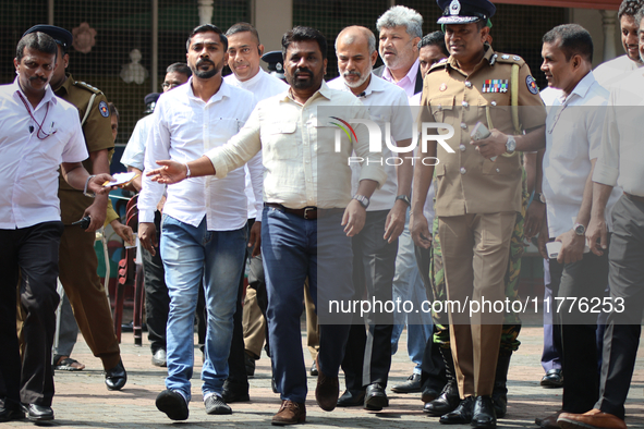 Sri Lankan president Anura Kumara Dissanayake acknowledges his supporters after casting his vote for the parliamentary election in Colombo,...