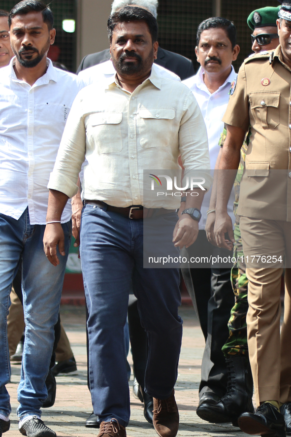 Sri Lankan president Anura Kumara Dissanayake acknowledges his supporters after casting his vote for the parliamentary election in Colombo,...