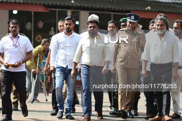 Sri Lankan president Anura Kumara Dissanayake acknowledges his supporters after casting his vote for the parliamentary election in Colombo,...