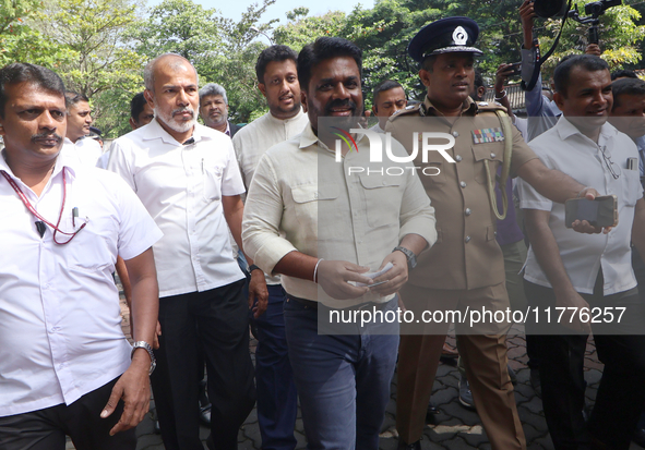 Sri Lankan president Anura Kumara Dissanayake acknowledges his supporters after casting his vote for the parliamentary election in Colombo,...