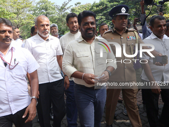 Sri Lankan president Anura Kumara Dissanayake acknowledges his supporters after casting his vote for the parliamentary election in Colombo,...