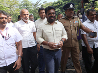 Sri Lankan president Anura Kumara Dissanayake acknowledges his supporters after casting his vote for the parliamentary election in Colombo,...