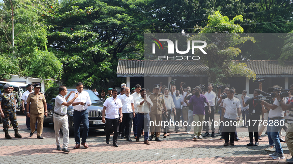 Sri Lankan president Anura Kumara Dissanayake acknowledges his supporters as he arrives to cast a vote for the parliamentary election in Col...