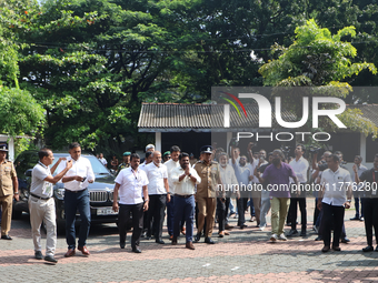 Sri Lankan president Anura Kumara Dissanayake acknowledges his supporters as he arrives to cast a vote for the parliamentary election in Col...