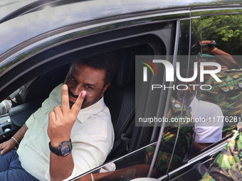 Sri Lankan president Anura Kumara Dissanayake acknowledges his supporters after casting his vote for the parliamentary election in Colombo,...