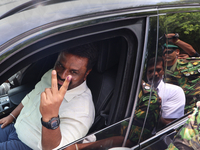 Sri Lankan president Anura Kumara Dissanayake acknowledges his supporters after casting his vote for the parliamentary election in Colombo,...