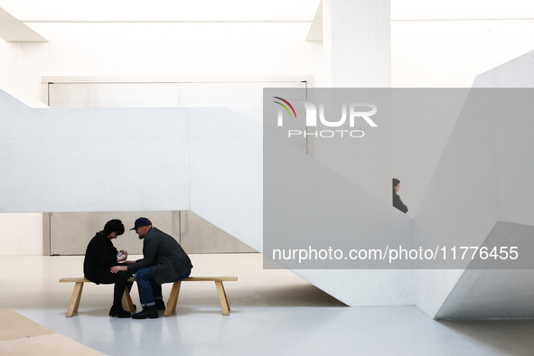 Visitors sit inside the Museum of Modern Art in Warsaw in Warsaw, Poland on November 14, 2024. 