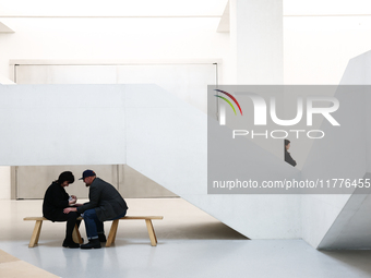 Visitors sit inside the Museum of Modern Art in Warsaw in Warsaw, Poland on November 14, 2024. (