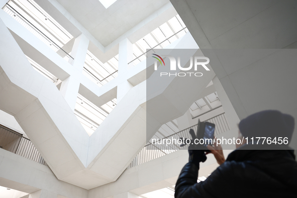 A visitor takes a photo inside the Museum of Modern Art in Warsaw in Warsaw, Poland on November 14, 2024. 