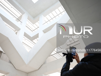 A visitor takes a photo inside the Museum of Modern Art in Warsaw in Warsaw, Poland on November 14, 2024. (