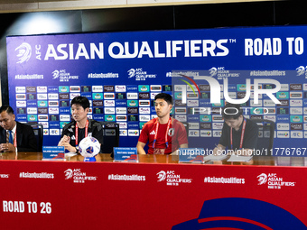 Japan head coach Hajime Moriyasu and Wataru Endo speak during a press conference before facing the Indonesia national team during the FIFA W...