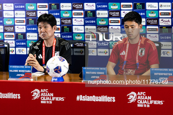 Japan head coach Hajime Moriyasu and Wataru Endo speak during a press conference before facing the Indonesia national team during the FIFA W...