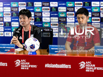 Japan head coach Hajime Moriyasu and Wataru Endo speak during a press conference before facing the Indonesia national team during the FIFA W...