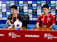 Japan head coach Hajime Moriyasu and Wataru Endo speak during a press conference before facing the Indonesia national team during the FIFA W...