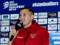 Jay Noah Idzes of Indonesia speaks during a press conference before facing the Japan national team during the FIFA World Cup Asian 3rd Quali...