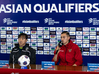 Head coach Shin Tae-Yong of Indonesia and Jay Noah Idzes speak during a press conference before facing the Japan national team during the FI...