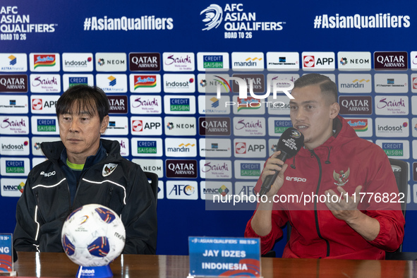 Head coach Shin Tae-Yong of Indonesia and Jay Noah Idzes speak during a press conference before facing the Japan national team during the FI...