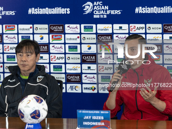 Head coach Shin Tae-Yong of Indonesia and Jay Noah Idzes speak during a press conference before facing the Japan national team during the FI...