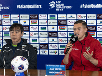 Head coach Shin Tae-Yong of Indonesia and Jay Noah Idzes speak during a press conference before facing the Japan national team during the FI...