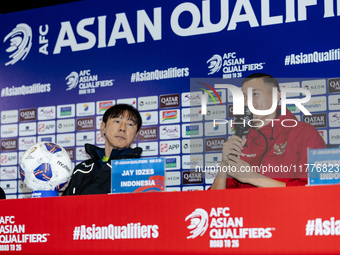 Head coach Shin Tae-Yong of Indonesia and Jay Noah Idzes speak during a press conference before facing the Japan national team during the FI...