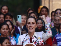 Mexico's President, Claudia Sheinbaum Pardo, speaks during the Original Textile Art Meeting, accompanied by indigenous craftswomen from diff...