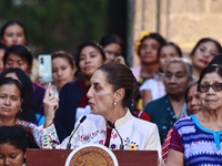 Mexico's President, Claudia Sheinbaum Pardo, speaks during the Original Textile Art Meeting, accompanied by indigenous craftswomen from diff...