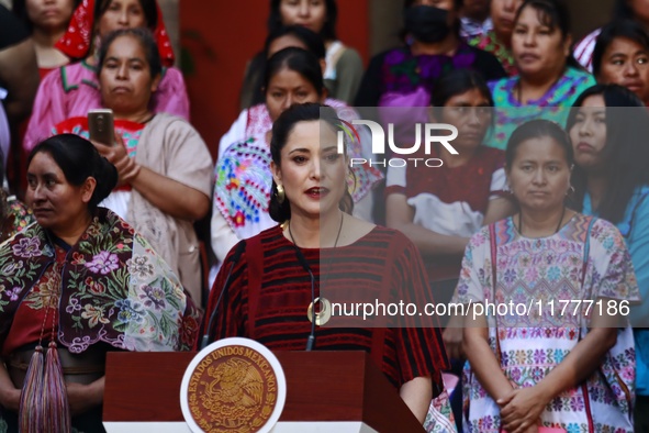 Claudia Icaza, Minister of Culture, speaks during the Original Textile Art Meeting, accompanied by indigenous craftswomen from different sta...