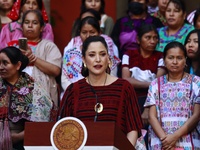 Claudia Icaza, Minister of Culture, speaks during the Original Textile Art Meeting, accompanied by indigenous craftswomen from different sta...