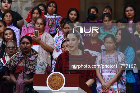 Claudia Icaza, Minister of Culture, speaks during the Original Textile Art Meeting, accompanied by indigenous craftswomen from different sta...