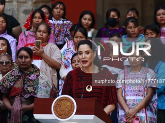 Claudia Icaza, Minister of Culture, speaks during the Original Textile Art Meeting, accompanied by indigenous craftswomen from different sta...