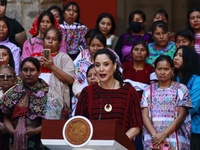 Claudia Icaza, Minister of Culture, speaks during the Original Textile Art Meeting, accompanied by indigenous craftswomen from different sta...