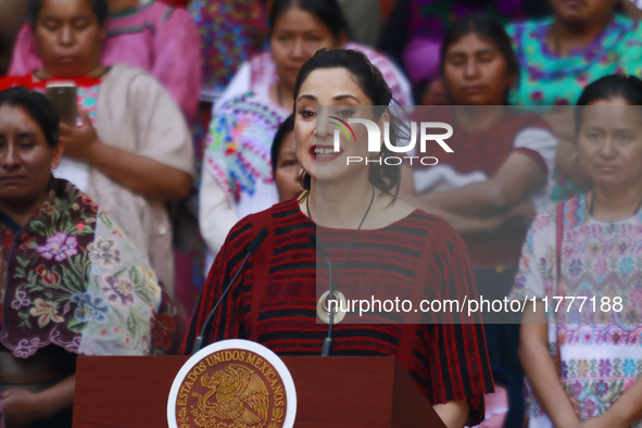 Claudia Icaza, Minister of Culture, speaks during the Original Textile Art Meeting, accompanied by indigenous craftswomen from different sta...