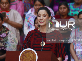 Claudia Icaza, Minister of Culture, speaks during the Original Textile Art Meeting, accompanied by indigenous craftswomen from different sta...