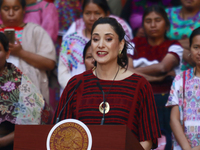 Claudia Icaza, Minister of Culture, speaks during the Original Textile Art Meeting, accompanied by indigenous craftswomen from different sta...