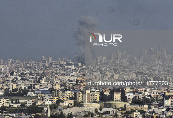 Smoke rises from a residential area after a series of Israeli airstrikes on the Dahieh region in southern Beirut, Lebanon, on November 14, 2...