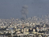 Smoke rises from a residential area after a series of Israeli airstrikes on the Dahieh region in southern Beirut, Lebanon, on November 14, 2...